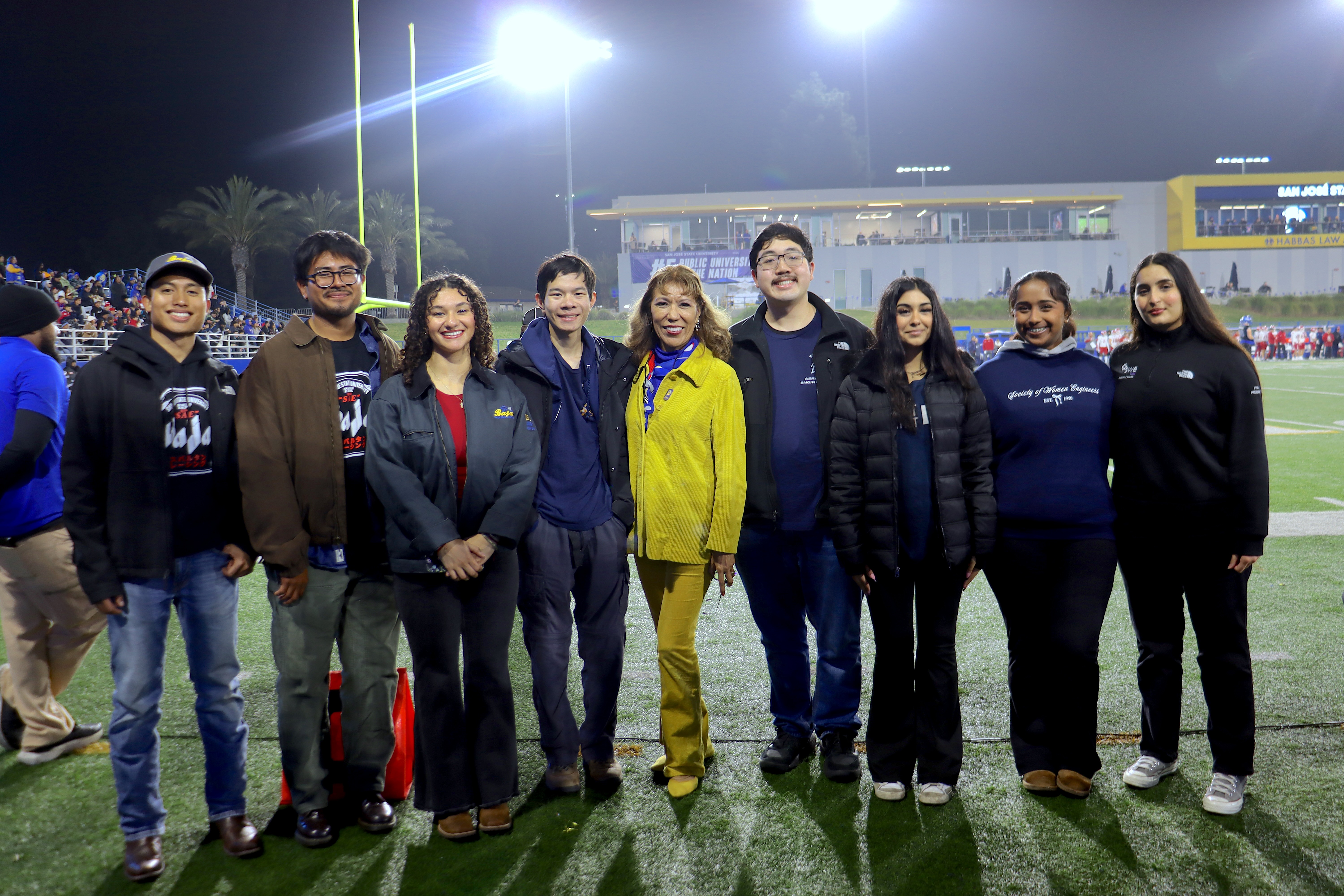 Engineering Club Students with University President at football game