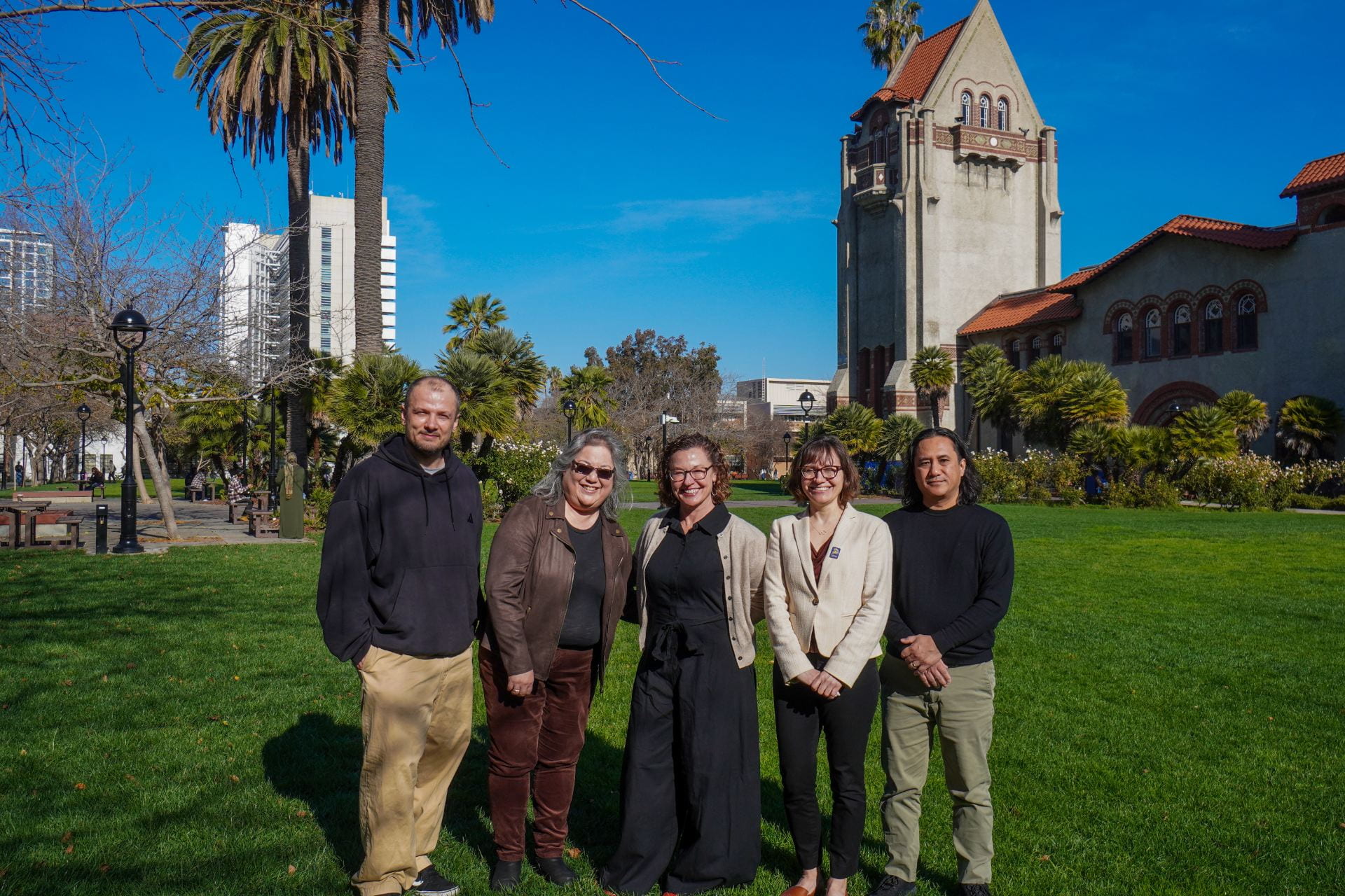 Left to right: Dogukan Ozgen, Lois Takahashi, Ellen Middaugh, Anne Marie Todd and Clifton Oyamot are partnering on a new initiative designed to train SJSU faculty in the College of Social Sciences and the Connie L. Lurie College of Education to be AI literate. Photo: Emily Ngo.